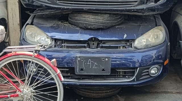 Dark blue Volkswagen Golf hatchback front halfcut — bumper, grille, headlights and fog lights, Sharjah market