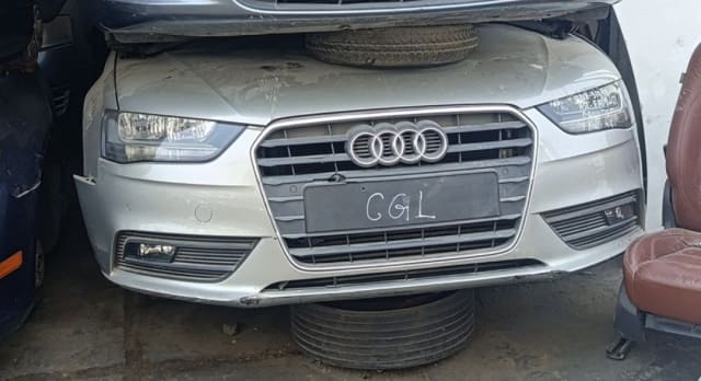 Silver Audi A4 sedan front halfcut — bumper, single-frame grille and headlights, Sharjah market