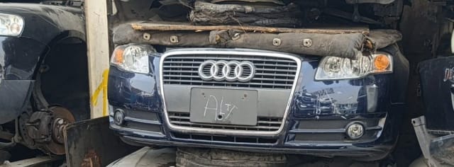 Dark blue Audi A4 halfcut front cut — grille, headlights, bumper and fog lights, Sharjah market
