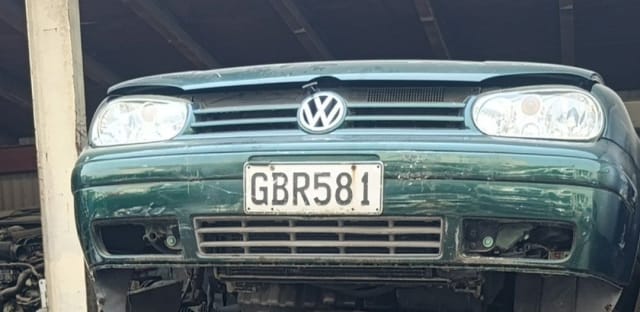 Dark green Volkswagen Golf front cut — bumper, grille and headlights, Sharjah market