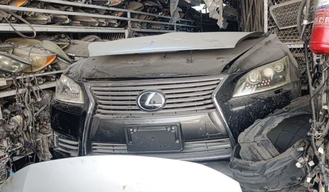 Black Lexus LS460 front cut — spindle grille, headlights, bumper and hood, Sharjah market