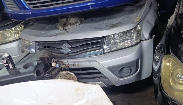 Silver Suzuki Grand Vitara SUV front cut — bumper, grille and headlight, Sharjah market