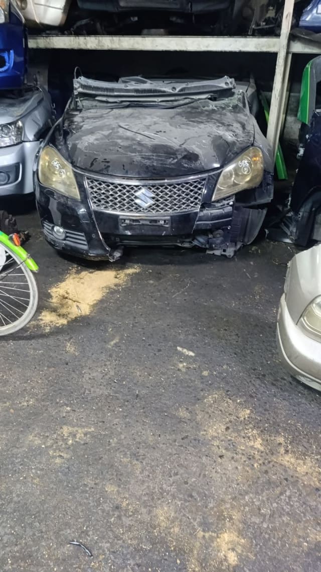 Black Suzuki Kizashi sedan front halfcut — hood, grille, headlights and bumper, Sharjah market