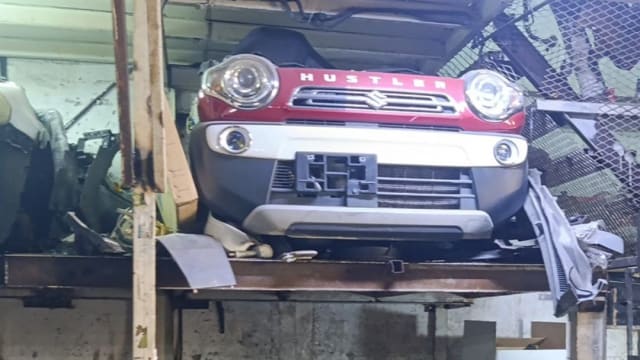 Red and white Suzuki Hustler front halfcut — bumper, grille and round headlights, Sharjah market