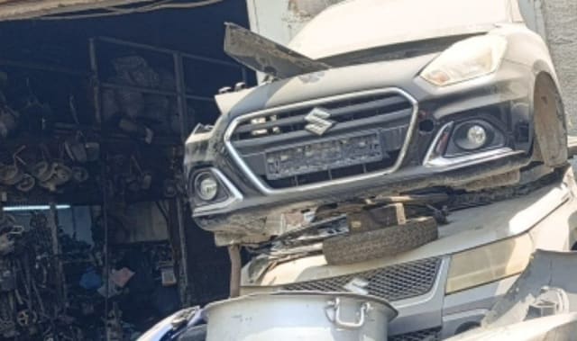 Silver-grey Suzuki Ciaz sedan front halfcut — bumper, grille, headlights and hood, Sharjah market