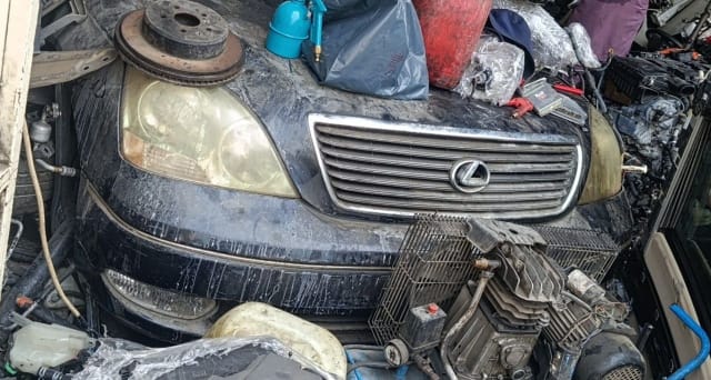 Dark grey Lexus LS430 sedan front halfcut — bumper, chrome grille and headlights, Sharjah market