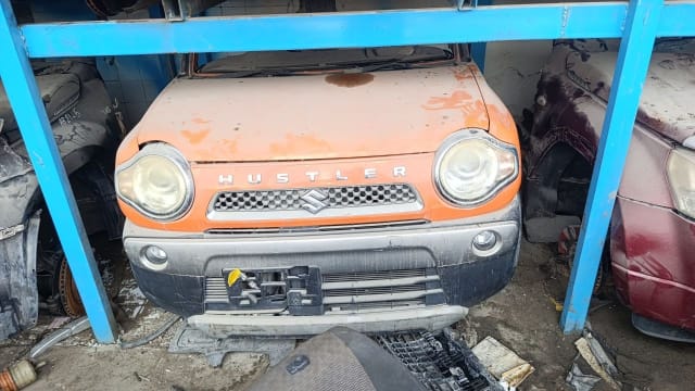 Orange Suzuki Hustler kei car front halfcut — headlights, grille and bumper, Sharjah market