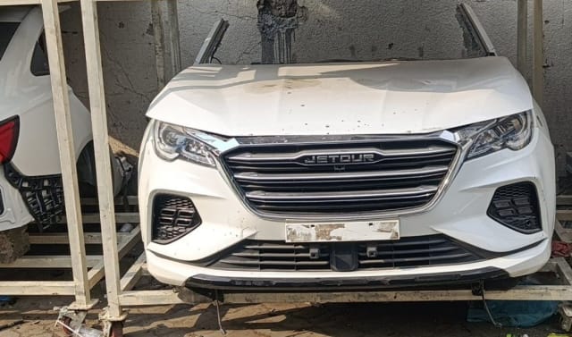 White Jetour X70 front cut — hood, bumper, chrome grille and headlights, Sharjah market