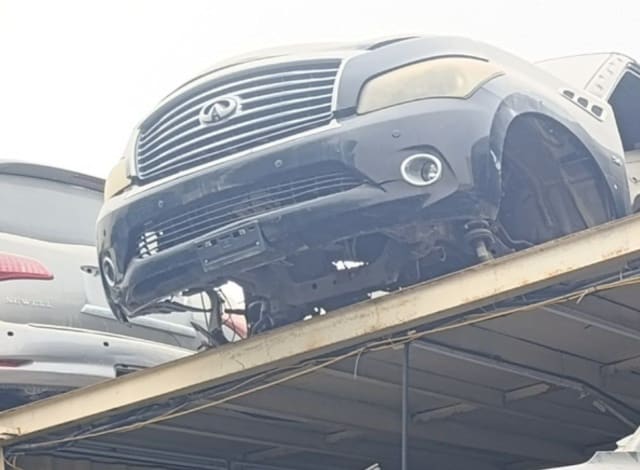Dark grey Infiniti QX56 front halfcut — grille, bumper, headlights and fenders, Sharjah market