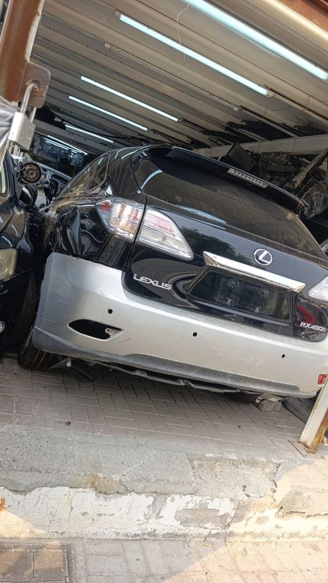 Black Lexus RX 450h rear halfcut — tailgate, tail lights and two-tone rear bumper, Sharjah market