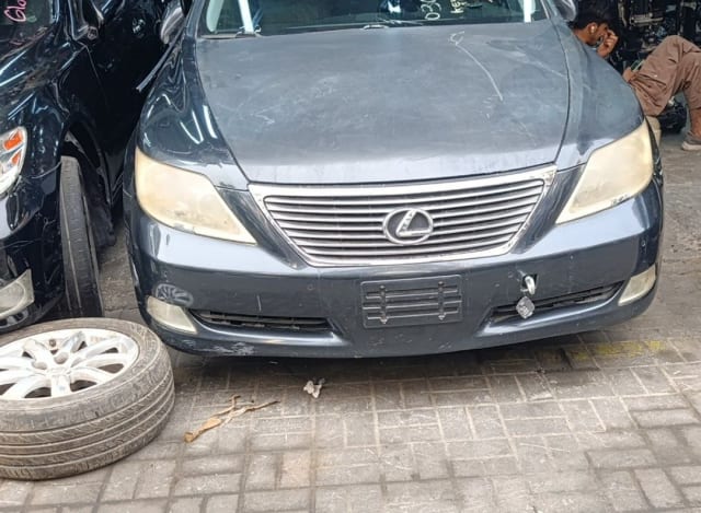 Dark grey Lexus LS460 sedan front — bumper, chrome grille and headlights, Sharjah market