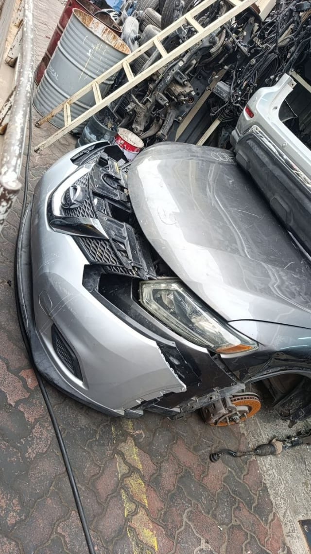 Silver Nissan Altima front halfcut — bumper, grille, headlight and hood, Sharjah market