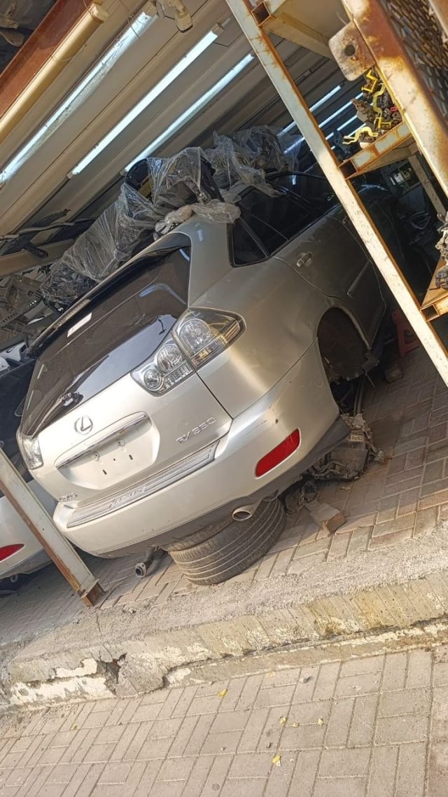Silver Lexus RX350 SUV rear halfcut — tailgate, tail lights and rear bumper, Sharjah market