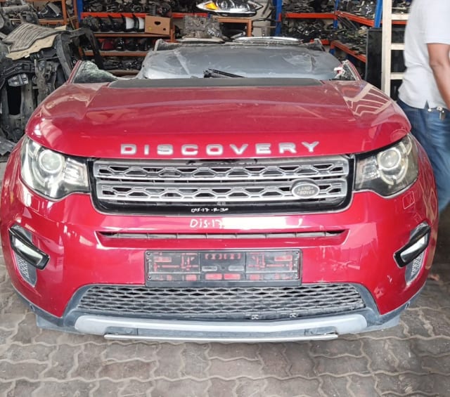 Red Land Rover Discovery Sport front halfcut — hood, bumper, grille and headlights, Sharjah market