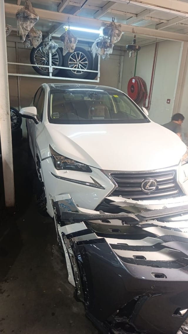 White Lexus NX SUV front halfcut — grille, headlights, hood and fenders, Sharjah market