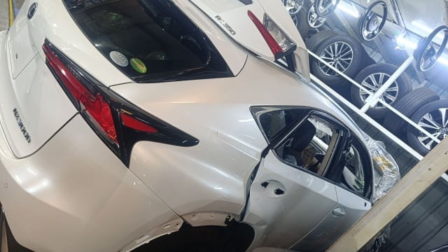 White Lexus NX300h rear halfcut — tail light, quarter panel and tailgate, Sharjah market