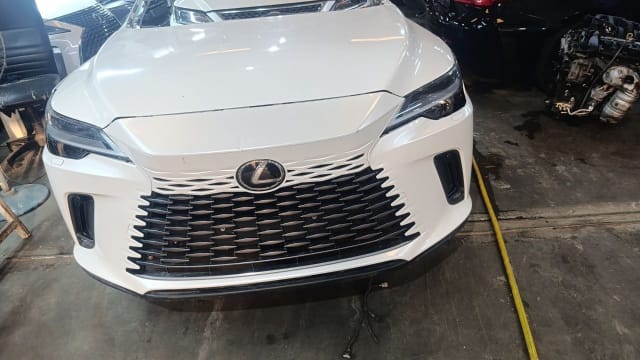 White Lexus RX SUV front halfcut — grille, headlights, hood and bumper, Sharjah market