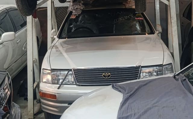 White Toyota Celsior front cut — grille, headlights, hood and windshield, Sharjah market