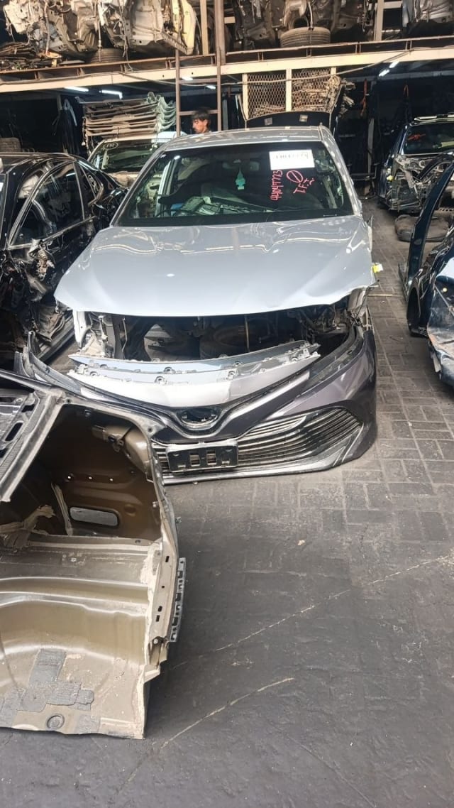 Silver Toyota Camry sedan front halfcut — hood, fenders, grille and bumper, Sharjah market