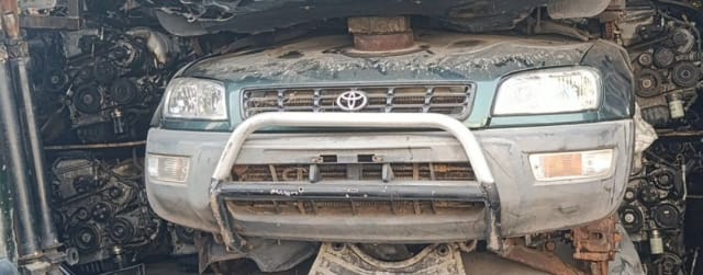 Green Toyota RAV4 SUV front cut — bumper, grille, headlights and chrome bull bar, Sharjah market