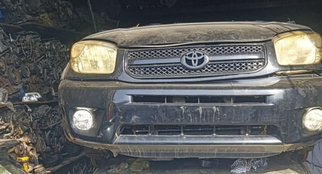 Black Toyota RAV4 SUV front cut — bumper, grille, headlights and fog lights, Sharjah market