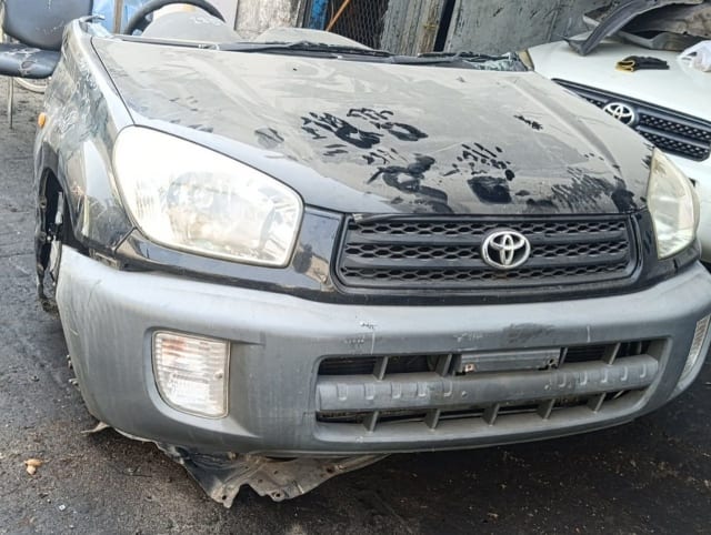 Black Toyota RAV4 SUV front cut — hood, grille, headlights and bumper, Sharjah market