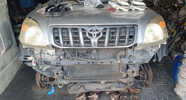 Silver Toyota Land Cruiser Prado front halfcut — grille, headlights, hood and radiator support, Sharjah market