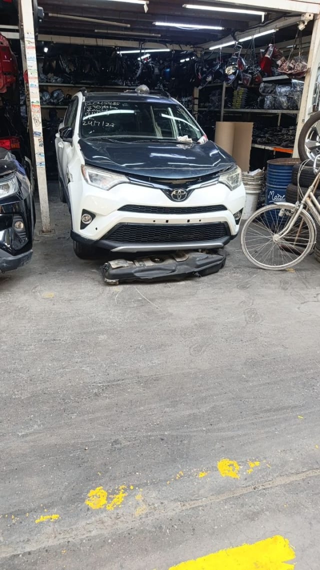 White Toyota RAV4 SUV front end for parts — bumper, grille and headlights, Sharjah market