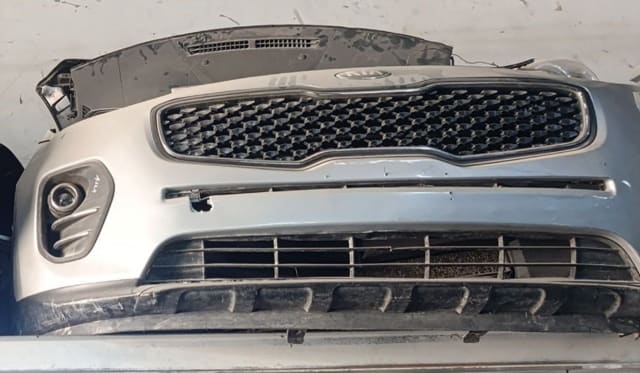 Silver Kia Sorento SUV front cut — front bumper, mesh grille and fog light, Sharjah market