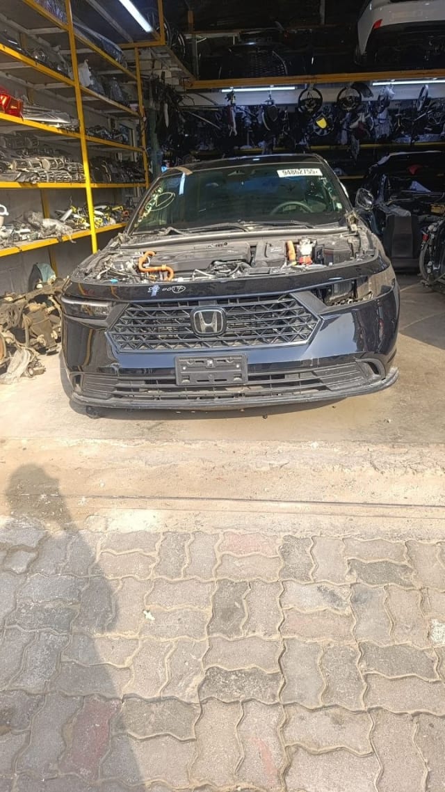 Black Honda Accord sedan front halfcut — bumper, grille, headlights and open engine bay, Sharjah market