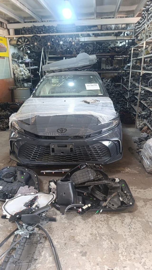 Dark grey Toyota Camry sedan halfcut — hood, front bumper, grille and headlights, Sharjah market