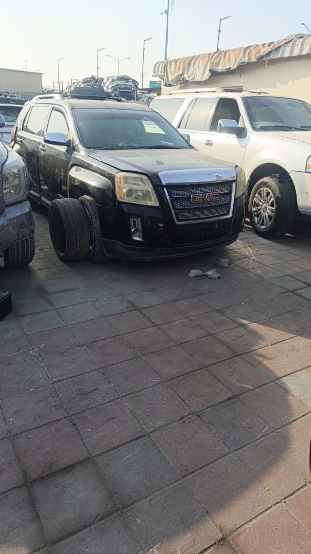 Black GMC Terrain SUV car for parts — front grille, bumper, headlights and hood, Sharjah market