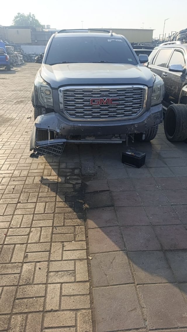 Grey GMC Yukon Denali front halfcut with Denali grille, headlights and hood, Sharjah market