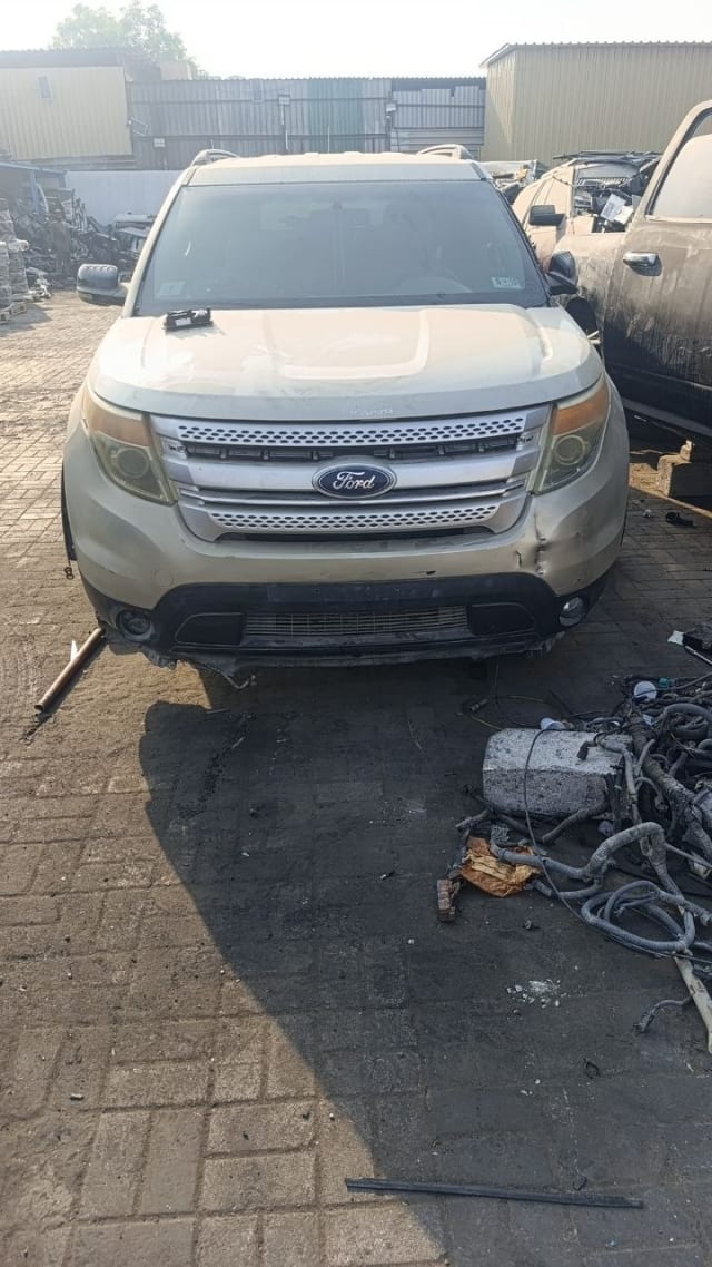 Gold Ford Explorer SUV front — grille, headlights, hood and fenders, car for parts, Sharjah market