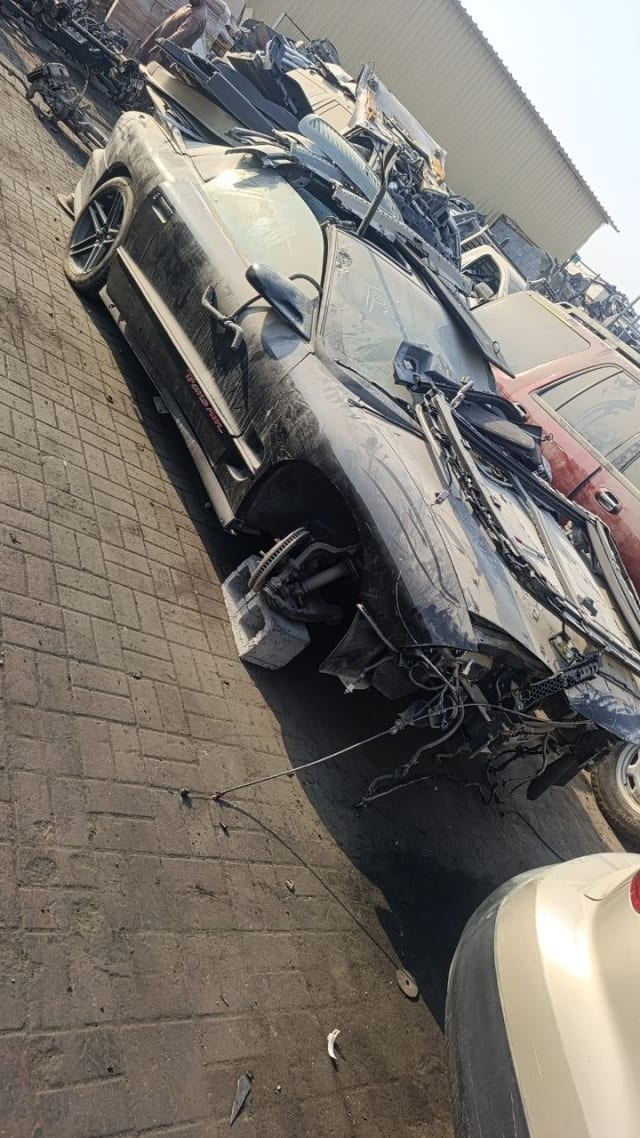 Black Pontiac Firebird Trans Am halfcut — front fender, alloy wheel and suspension, Sharjah market