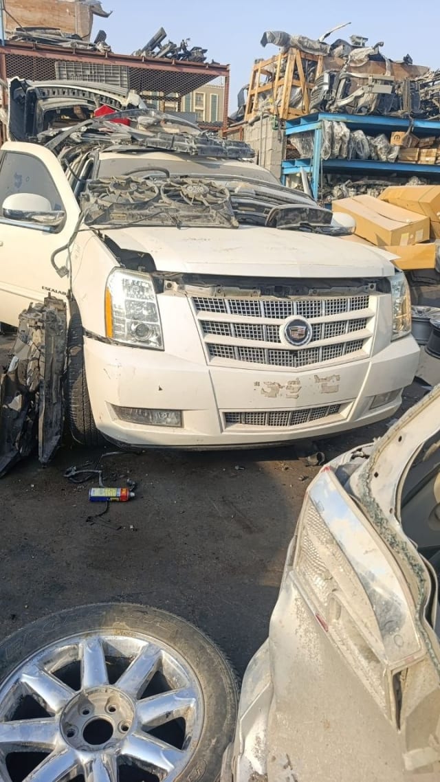 White Cadillac Escalade front halfcut — chrome grille, headlights, hood and bumper, Sharjah market