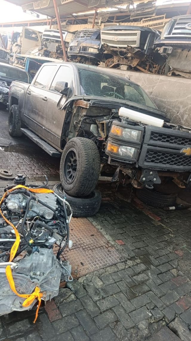 Dark grey Chevrolet Silverado 1500 crew cab halfcut — grille, headlights, doors and wheels, Sharjah market