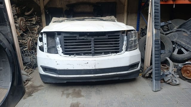 White Chevrolet Tahoe SUV halfcut front — hood, bumper, grille and headlight, Sharjah market
