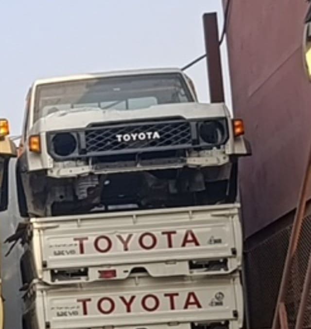 White Toyota Land Cruiser 70 Series halfcut front — grille, windshield and cabin, headlights removed, Sharjah market