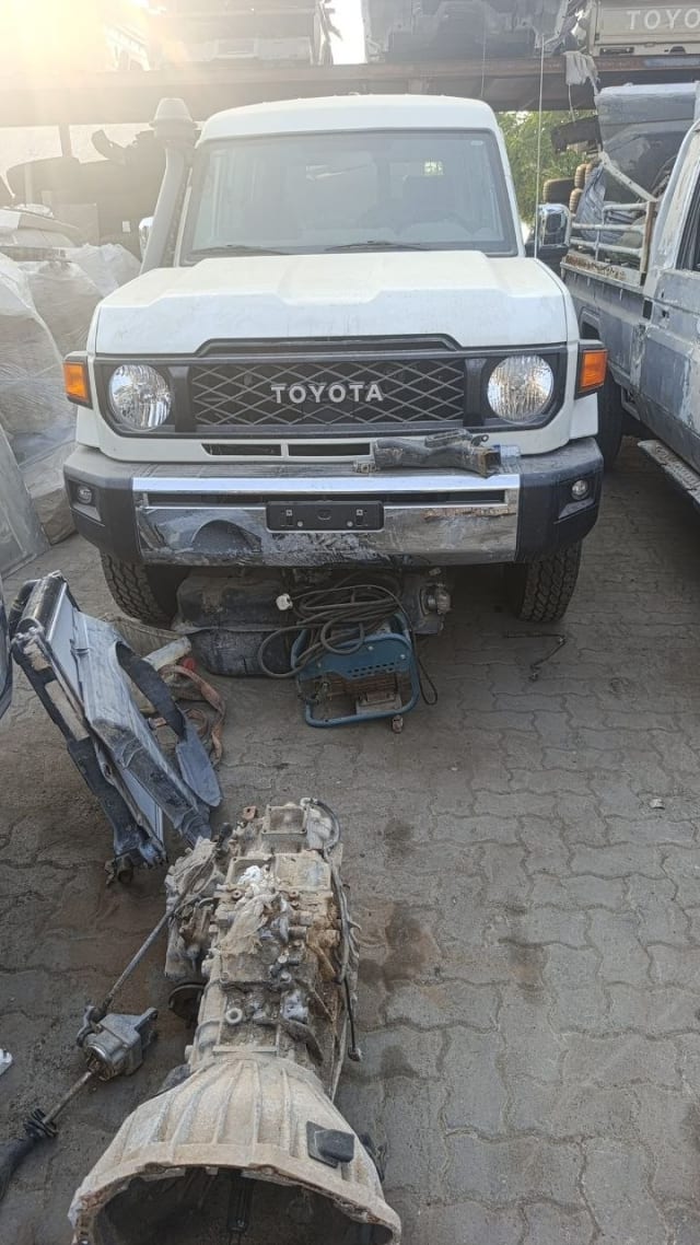 White Toyota Land Cruiser 70 Series front — grille, headlights, bumper with removed transmission, Sharjah market