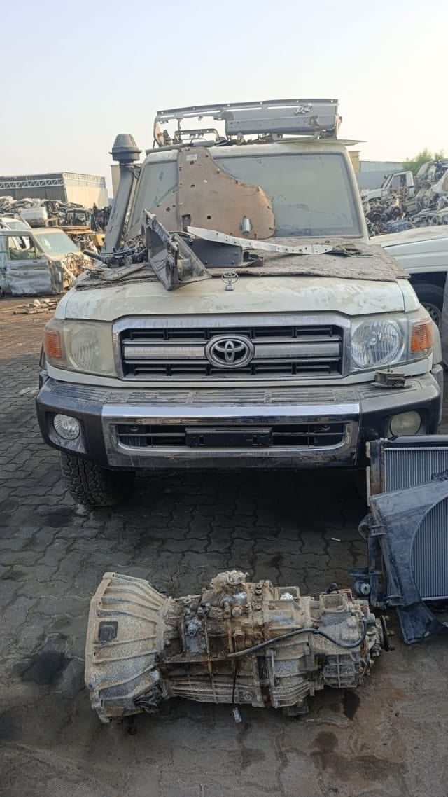 Beige Toyota Land Cruiser 70 Series halfcut — grille, bumper, headlights with gearbox and radiator, Sharjah market