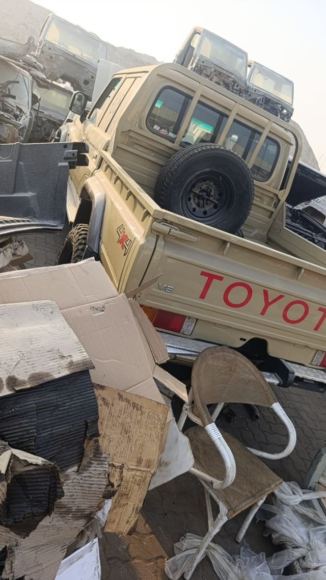 Beige Toyota Land Cruiser 79 LC70 single-cab pickup for parts — bed, tailgate and taillights, Sharjah market