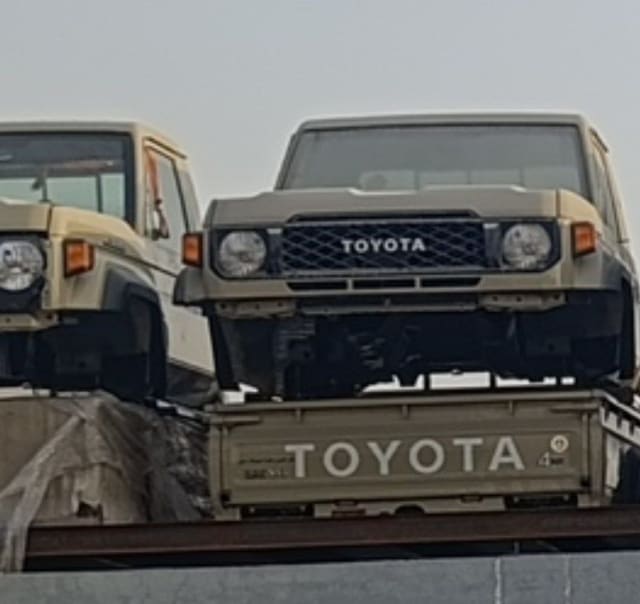 Beige Toyota Land Cruiser 70 Series front — grille, headlights and Toyota badge, Sharjah market