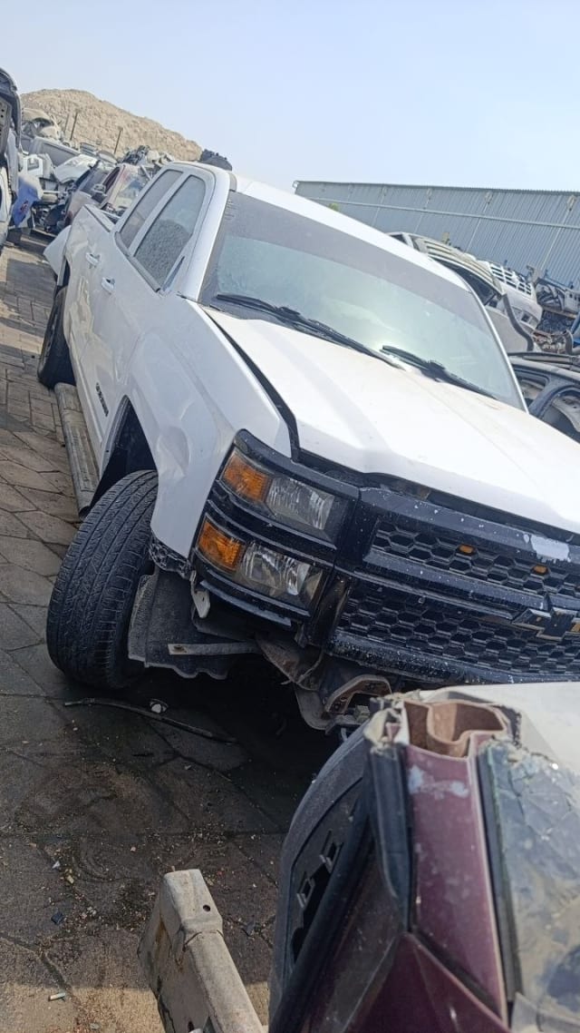 White Chevrolet Silverado 1500 pickup halfcut — grille, headlights, hood and fender, Sharjah market