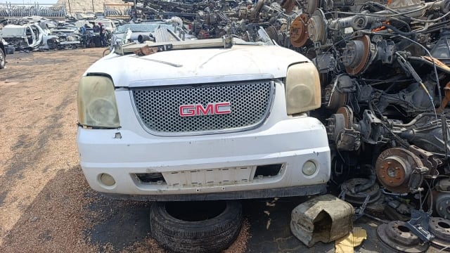 White GMC Yukon SUV front cut — bumper, mesh grille, headlights and hood, Sharjah market