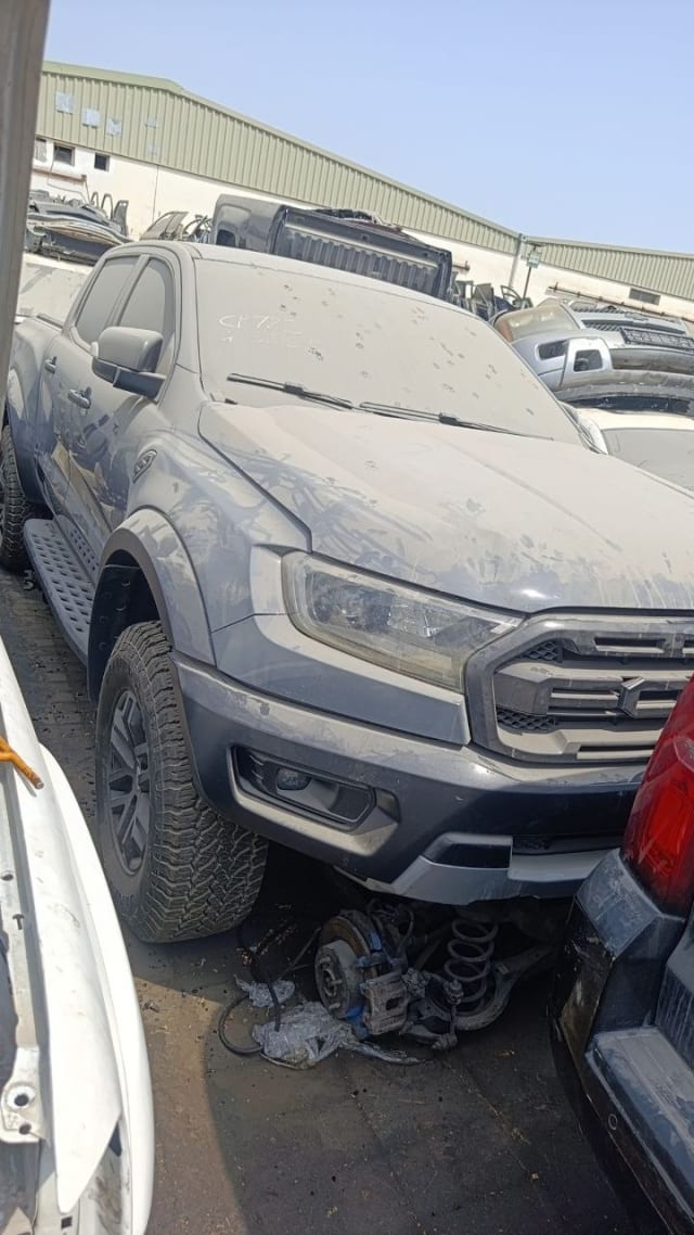 Grey Ford Ranger Raptor front cut — bumper, grille, headlights and exposed suspension, Sharjah market