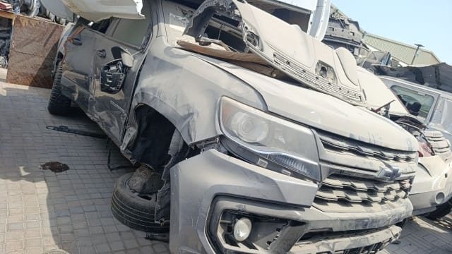 Tan Chevrolet Colorado pickup halfcut front cut — bumper, grille and headlights, Sharjah market