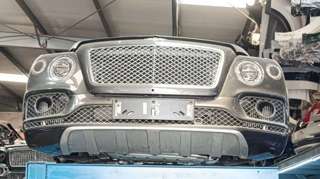 Dark grey Bentley Bentayga front cut — chrome grille, LED headlights and bumper, Sharjah market