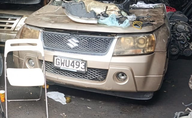 Gold Suzuki Grand Vitara SUV front halfcut — bumper, grille, headlights and fog lights, Sharjah market