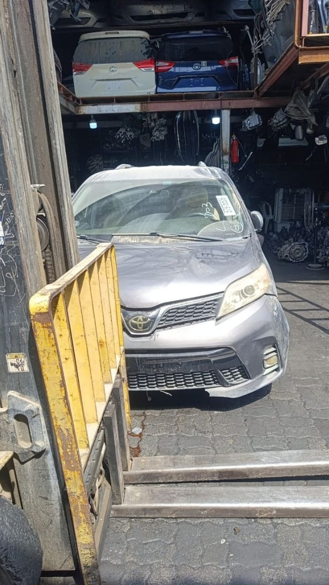 Grey Toyota Sienna minivan front — bumper, grille, headlights and hood, Sharjah market